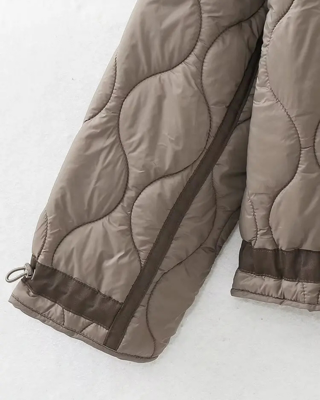 Quilted High-Neck Puffer Jacket with Drawstring in Taupe