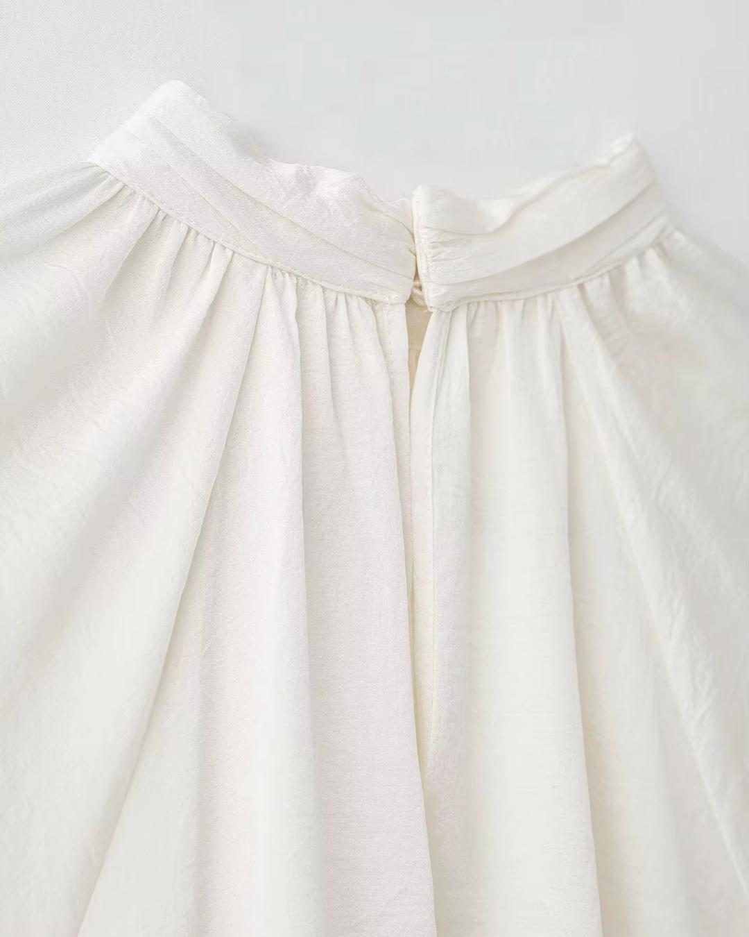 High-Neck Ruffled Chiffon Blouse in Creamy Off-White